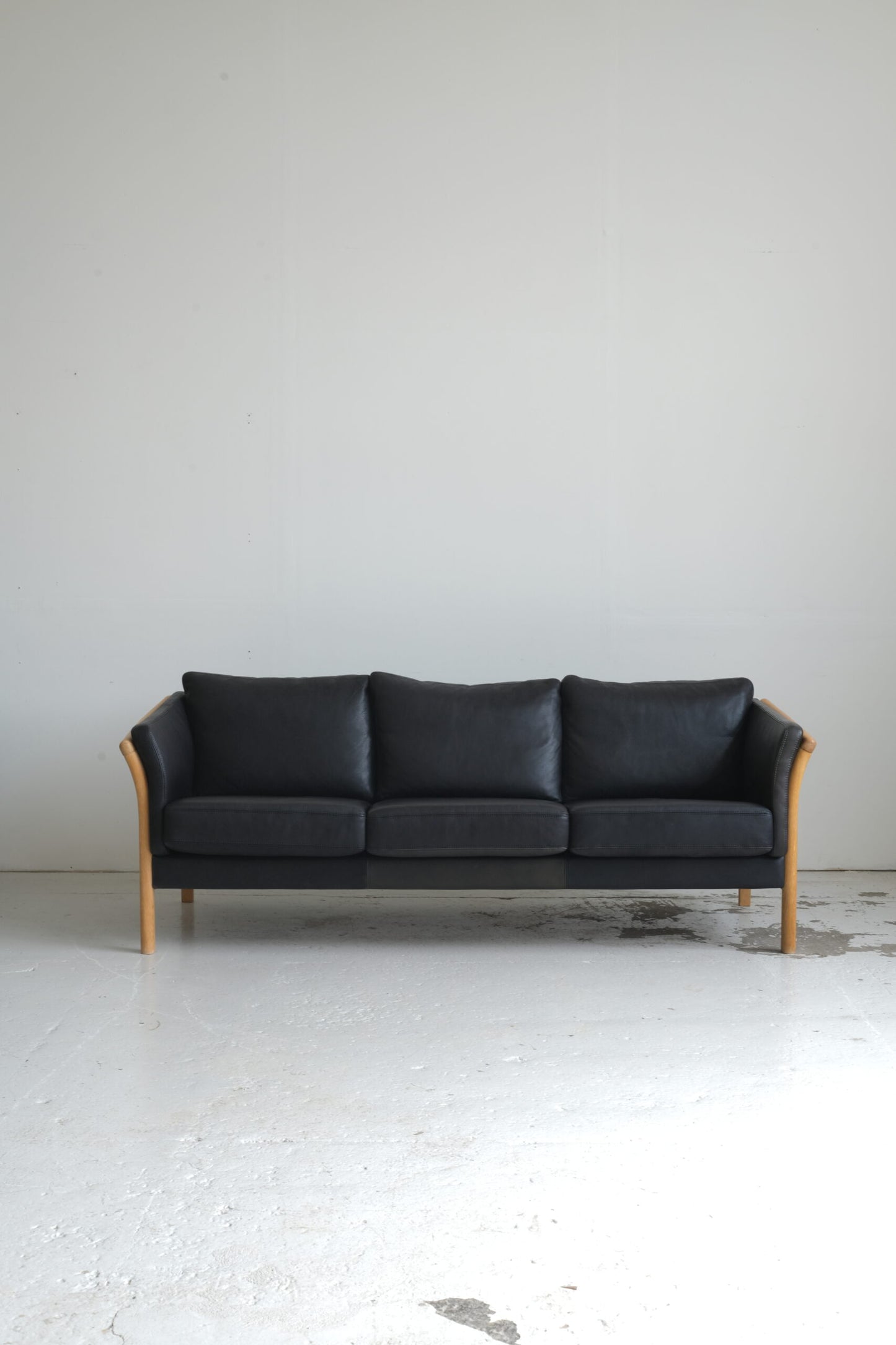 Three-seater sofa, black leather