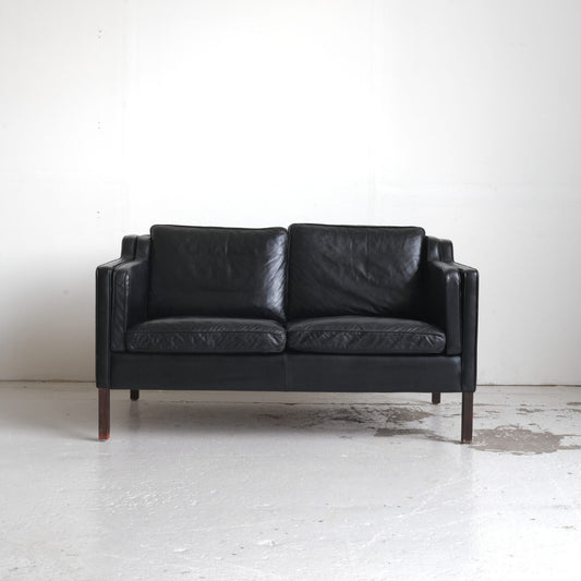 Stouby, two-seater sofa black leather