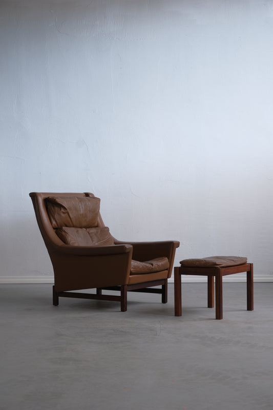 Danish armchair with footstool, rosewood legs