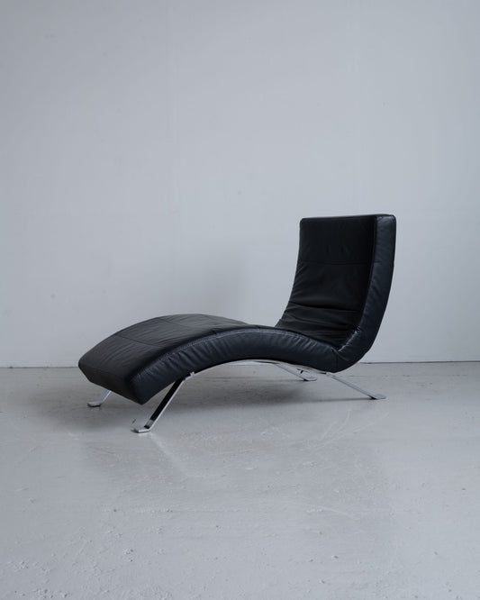 Reclining black leather lounge chair (2000s)