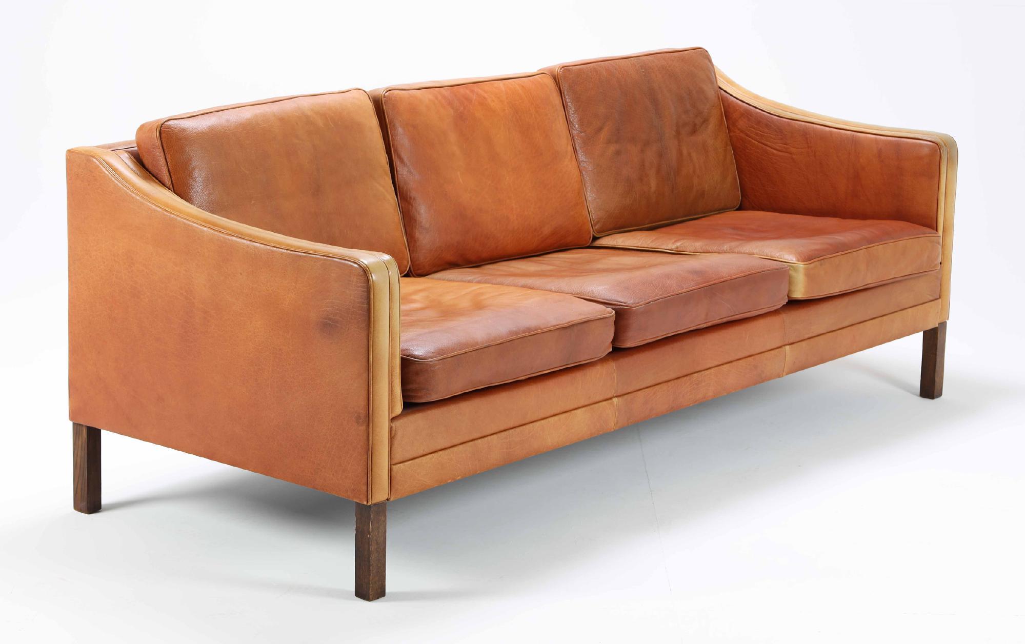 Danish furniture manufacturer: Three-person sofa with cognac-colored aniline leather cover