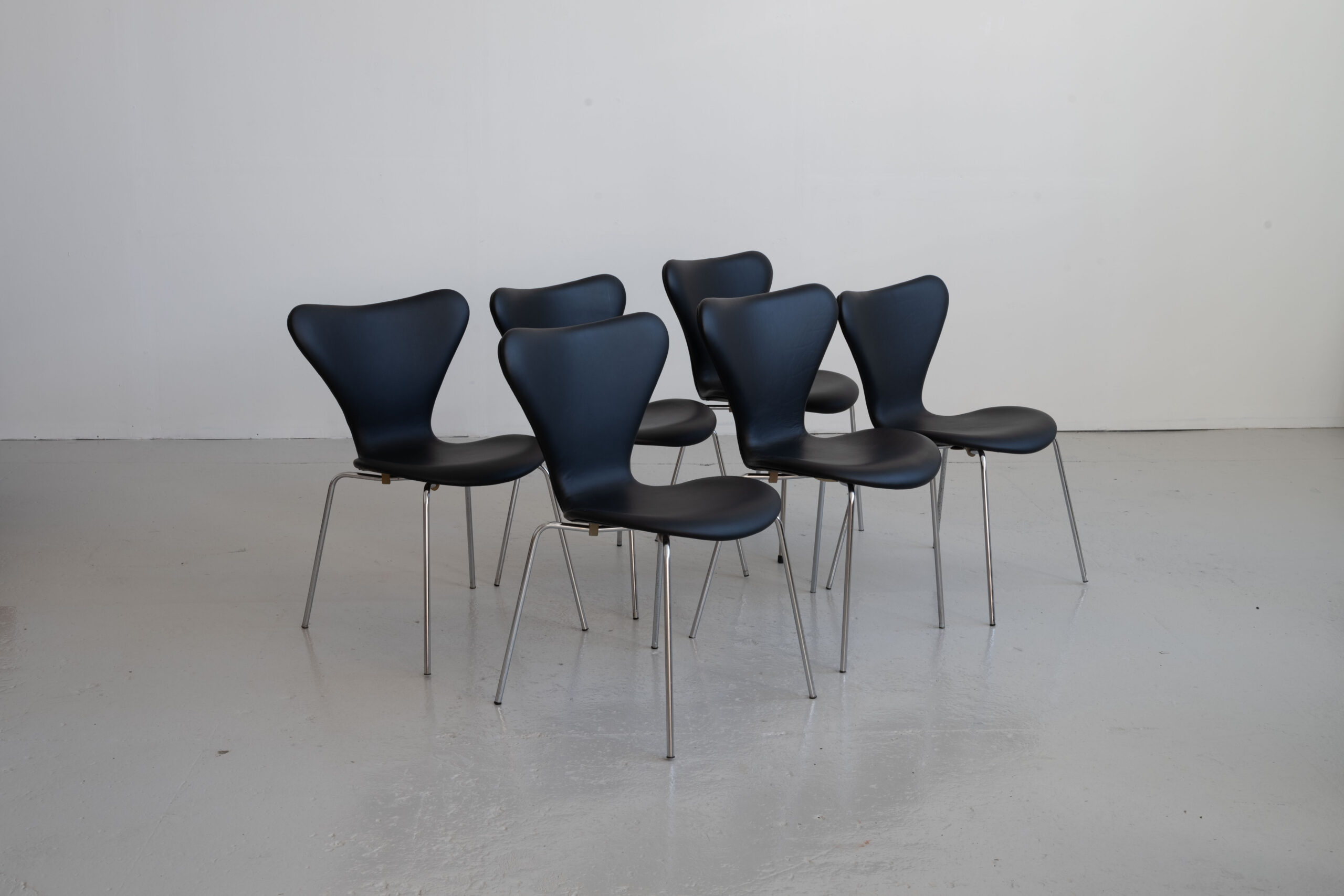 *RESERVED* Arne Jacobsen 7 chairs upholstered in black leather